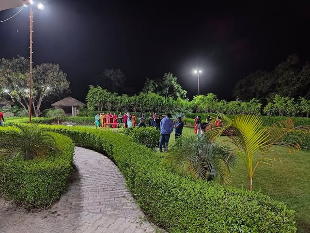 Guests gathered on the lawn at Manu Resort in the evening